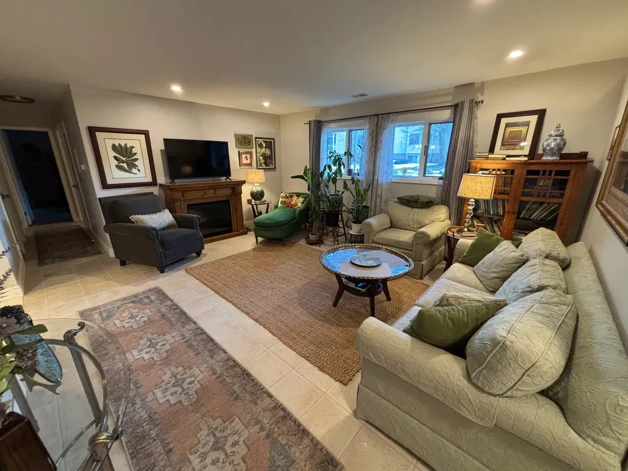 Renovated condo living room with fireplace and natural light