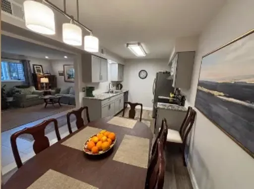 Condo interior after renovation: dining area open to the kitchen