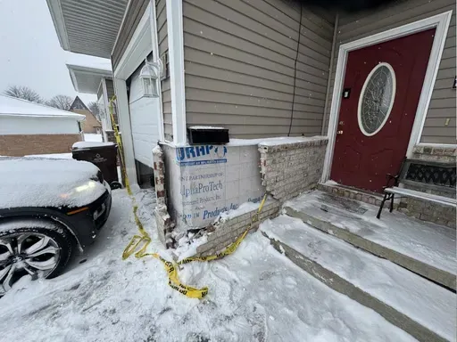 Condo entry steps before repair, in winter